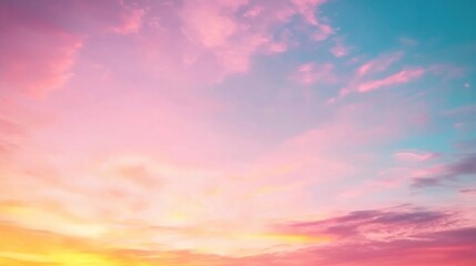 Obraz premium The vast sky awakens at dawn, showcasing soft pink and gold shades that blend gently with serene blue. Clouds stretch across the horizon, evoking a sense of tranquility and renewal