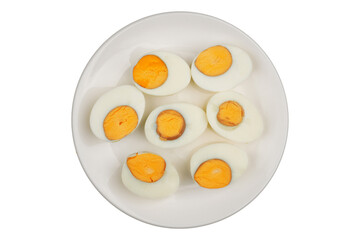 Slices of peeled boiled eggs on a white plate isolated transparent