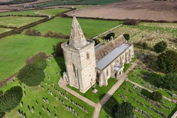 aerial view of Church of St Oswald, Lythe, is the parish church for the village of Lythe on the North Yorkshire coast