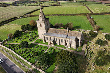 aerial view of Church of St Oswald, Lythe, is the parish church for the village of Lythe on the North Yorkshire coast