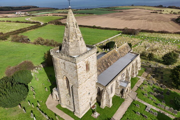 aerial view of Church of St Oswald, Lythe, is the parish church for the village of Lythe on the...