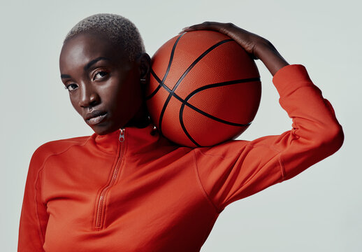 Serious, black woman and portrait with basketball in studio, balance and skills for game competition. Fitness, female person and player with ideas for practice, training and sport by white background