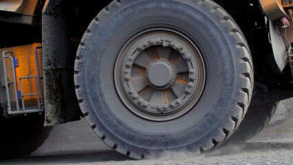 A Heavy Duty Truck Tire in Action Performing on a Construction Site with Multiple Activities. Stock...