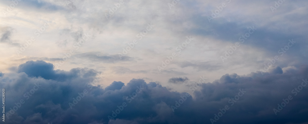 Wall mural dark blue clouds in the evening sky