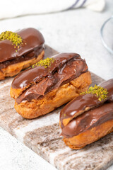 Chocolate eclair dessert on gray background