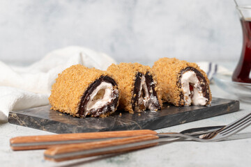 Strawberry roll dessert on gray background