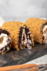 Strawberry roll dessert on gray background