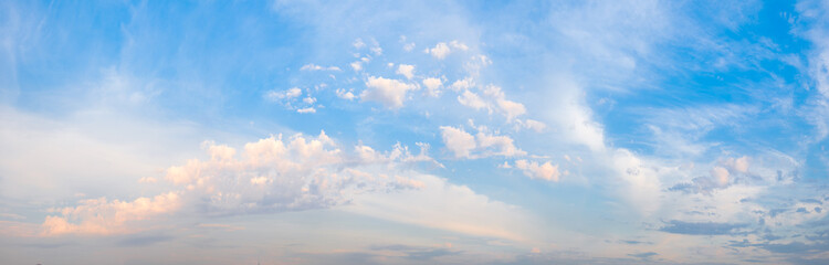 A beautiful blue sky with pink clouds. The sky is a perfect backdrop for a beautiful sunset