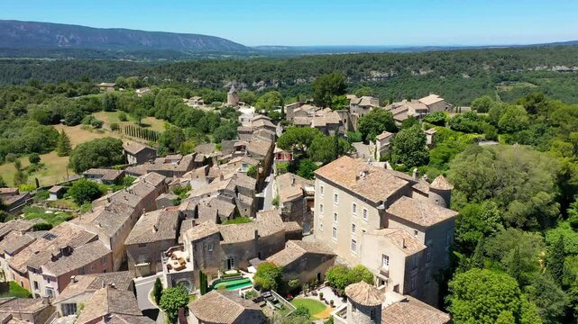 View of Goult, a small typical town in Provence, France. Discover the stunning hilltop village of Goult in Provence on a sunny day. Ancient hilltop village of Goult, Provence, France.