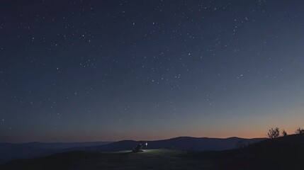 Fototapeta premium Serene Starry Night Landscape with Silhouetted Hills
