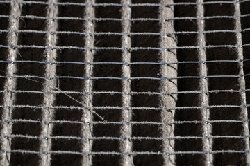 Close up of home air filter showing the dirt and particle cause bacteria inflection and sickness.