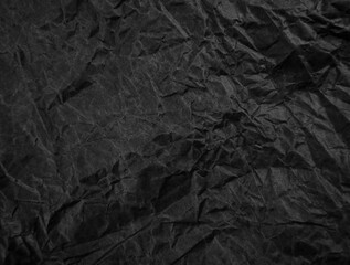 Black crumpled paper texture pattern. Rough grunge old blank.