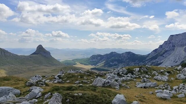 Summer time in Durmitor National Park. Beuatiful view on mountains. Wild nature, sunny, clouds