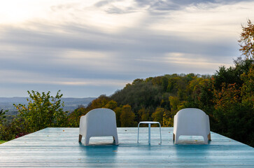 Chairs on a deck against overlooking the English countryside in autumn
