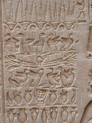 Egyptian hieroglyphic engravings on the stone walls of the temple of the God Horus in Edfu Egypt