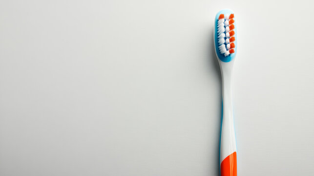 "A plastic toothbrush and toothpaste arranged on a light background in a flat lay style, with space available for text."




