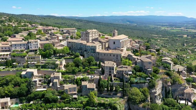 View on Gordes, a small typical town in Provence, France. Discover the stunning hilltop village of Gordes in Provence on a sunny day. Ancient hilltop village of Gordes, Provence, France.