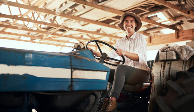 Portrait, smile and woman with tractor on farm for agriculture transport, greenhouse and crops harvest. Happy, girl and drive with machine truck for farming production, sustainable industry and agro - Powered by Adobe