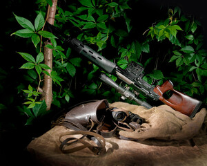 Still life with a gun and binoculars