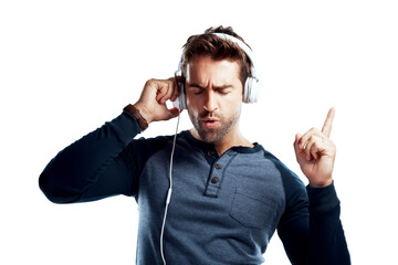 Fototapeta premium Dancing, energy and man with headphones, listening to music and model isolated on white studio background. Person, dancer and guy with headset, stress relief and streaming for sound, audio and song