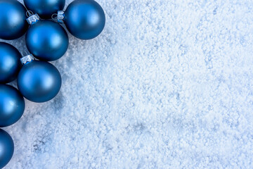 blue christmas balls on snow. Christmas card concept