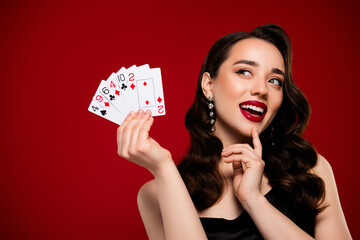 Photo of cunning lady bluff show poker cards full house winner victory in casino on red background