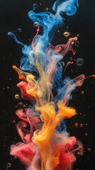 Obraz premium Vibrant ink explosion of red, blue, and yellow colors in dark space