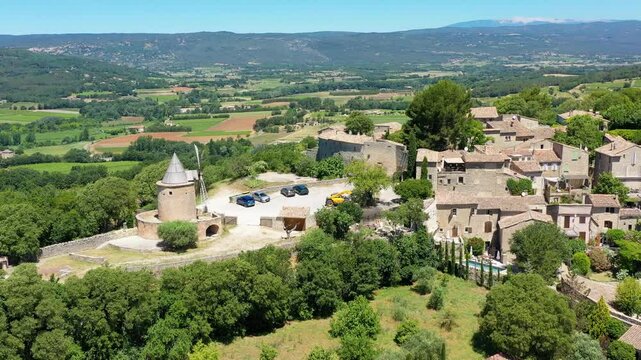 View of Goult, a small typical town in Provence, France. Discover the stunning hilltop village of Goult in Provence on a sunny day. Ancient hilltop village of Goult, Provence, France.