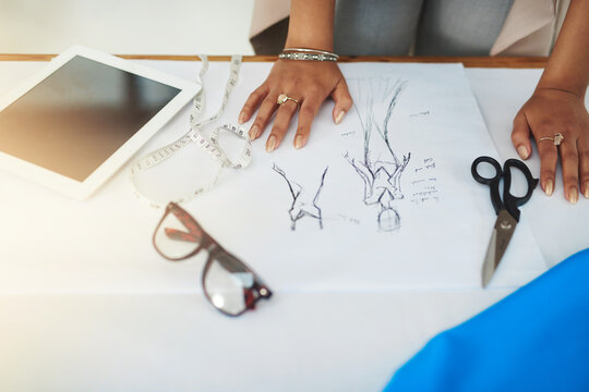 Hands, fashion designer and sketch with paperwork at workshop for review process, style and inspiration. Person, document and drawing with creativity for garment, clothes and tablet at small business