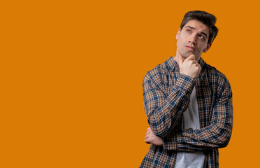 Thinking around mature man, yellow background. Smart student guy finding answer