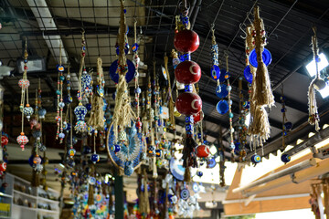 Evil eye beads, multi-colored seashells and souvenirs