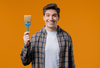 Creative painter artist man with brush on yellow background. Fantasy, idea © kohanova1991