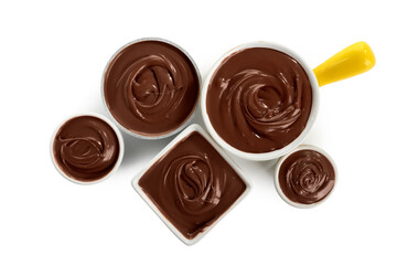 Bowls of sweet melted chocolate on white background