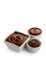 Bowls of sweet melted chocolate on white background