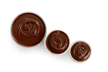 Bowls of sweet melted chocolate on white background