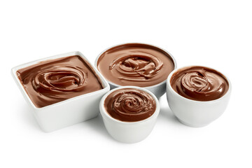 Bowls of tasty melted chocolate on white background