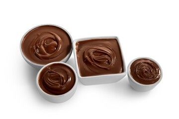 Bowls of tasty melted chocolate on white background