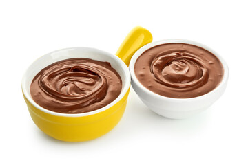 Different bowls of tasty melted chocolate on white background