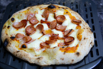 Rustic artisanal pepperoni pizza with red onion