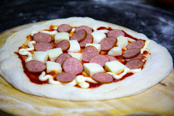 Rustic artisanal pepperoni pizza with red onion