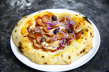 Rustic artisanal pepperoni pizza with red onion