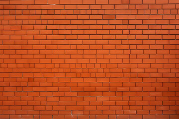 Obraz premium Rote Backsteinmauer in symmetrischem Muster - KI generiert