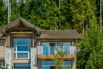 A perfect neighborhood. Houses in suburb at Fall in the north America. Top of a luxury house with...