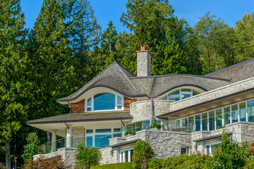 A perfect neighborhood. Houses in suburb at Fall in the north America. Top of a luxury house with...