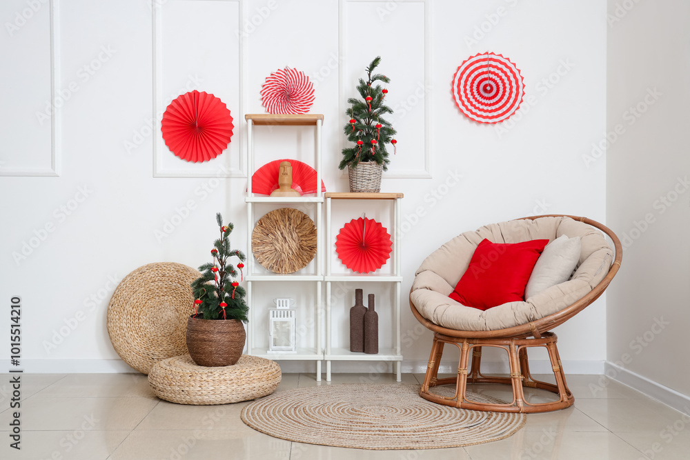 Wall mural Interior of living room with armchair, fir trees and decor for Japanese New Year celebration