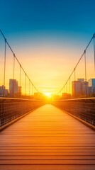 Obraz premium Suspension bridge leading towards a vibrant sunset skyline.