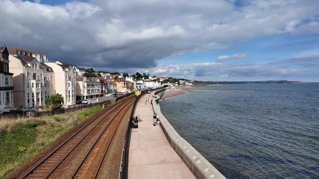 Dawlish Devon England. 01.10.2024. Video.  Red locomotive passing through Dawlish  Devon, UK.