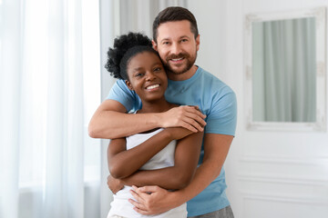 Fototapeta premium International relationships. Portrait of lovely couple at home