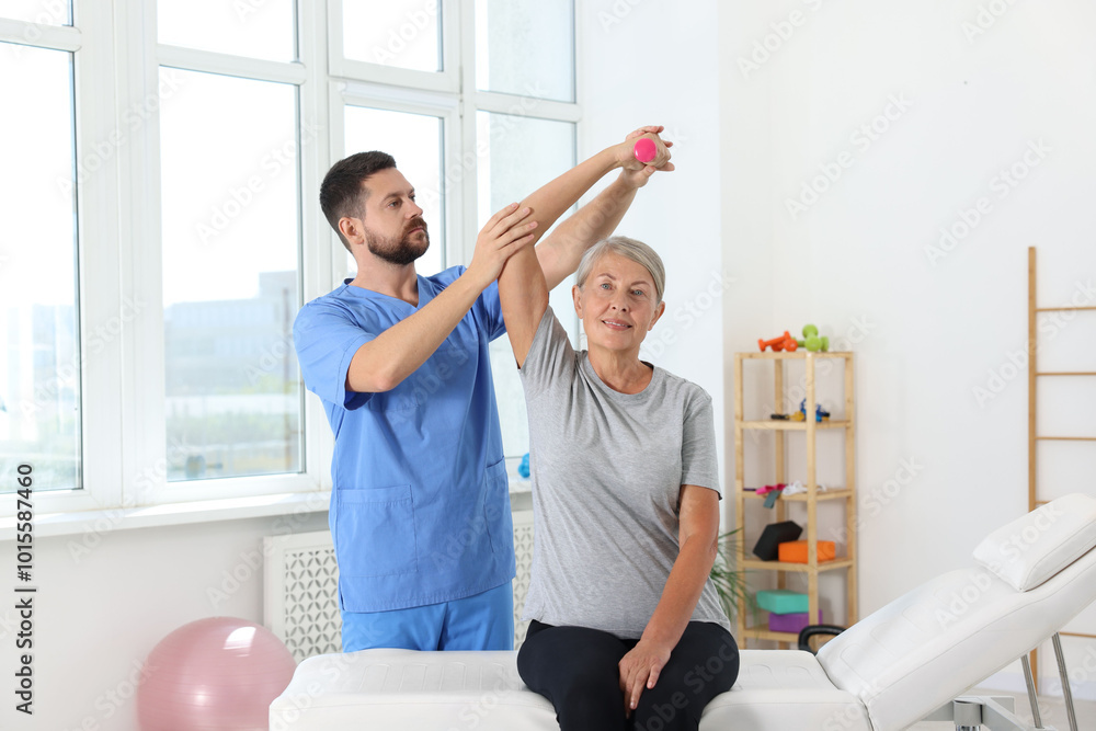 Canvas Prints Senior patient exercising under physiotherapist supervision in rehabilitation center