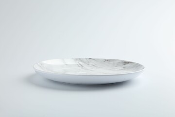 One empty ceramic plate isolated on white
